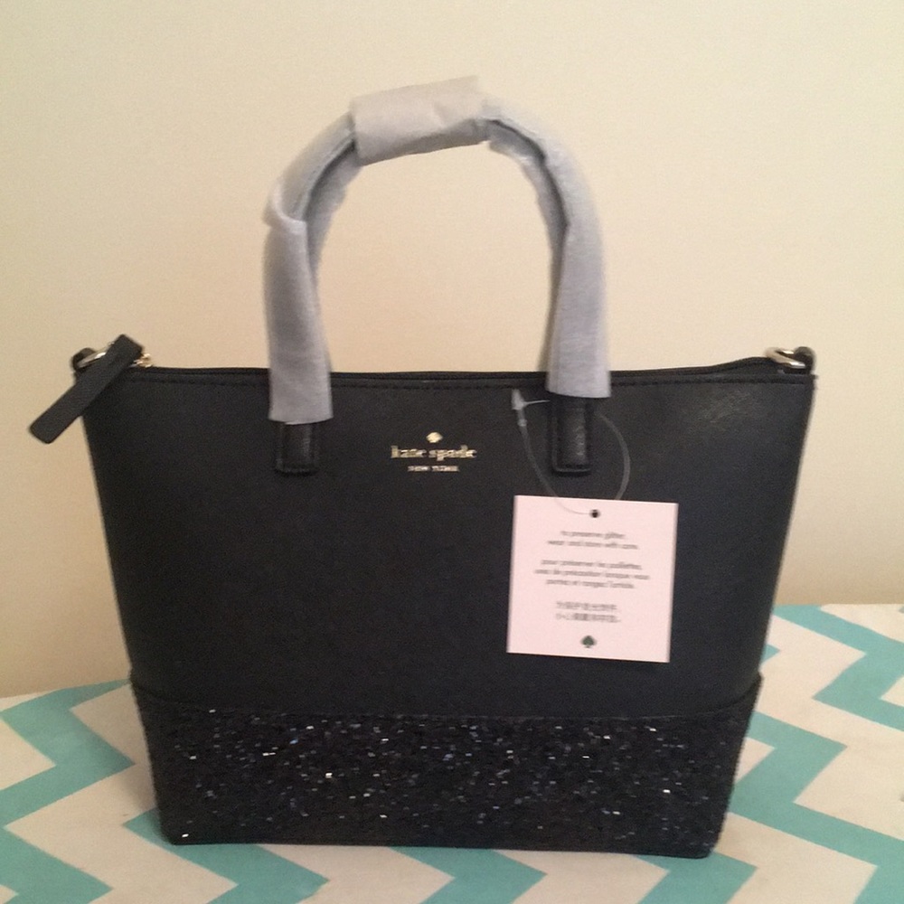 Kate Spade new with tags black handbag. 2 inch sequins surround bottom of bag